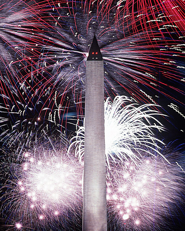 Fireworks in the night sky behind the Washington Monument